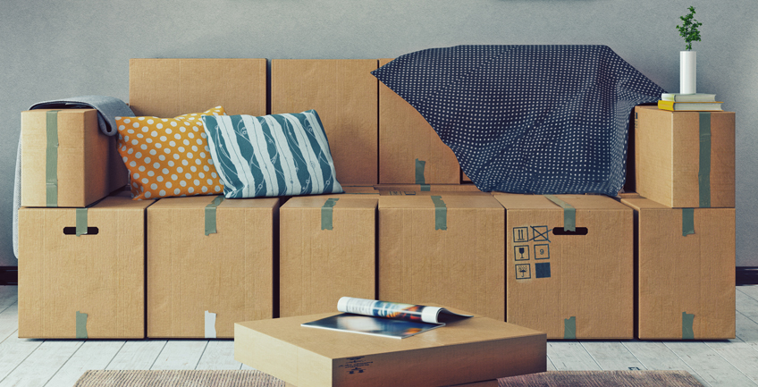 Improvised sofa made from cardboard boxes reflecting budget interior design challenges in Denver