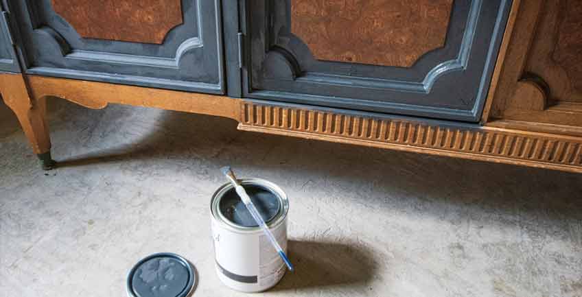 Colorado interior mishap with dresser and paint bucket showing DIY tension
