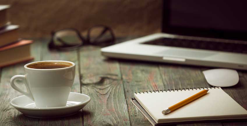 Essential tech tools for Colorado interior designers featuring laptop and AutoCAD workspace