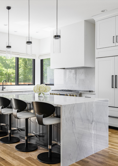 Modern Denver kitchen featuring waterfall edge countertop