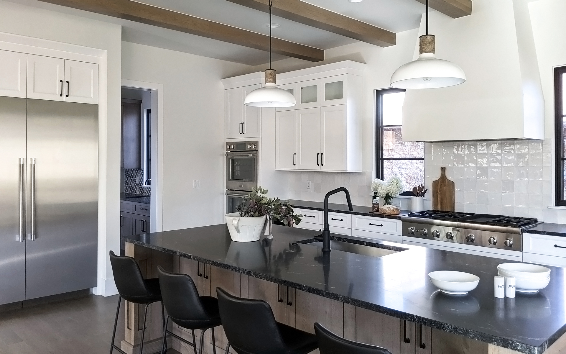 White and black kitchen design with modern interior styling in Denver home